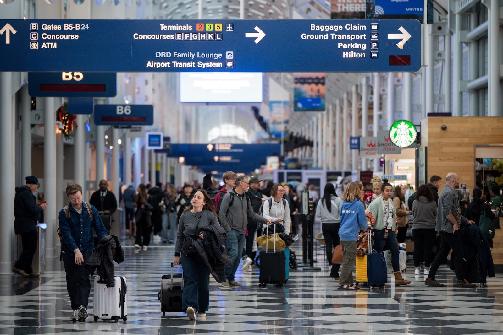 Travelers At ORD Airport Ahead Of Christmas Holiday